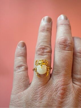 Gold-tone scarab ring with white stone